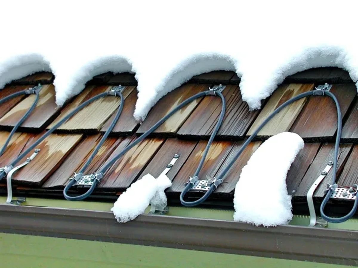 Heat cables on a snow-covered wooden roof
